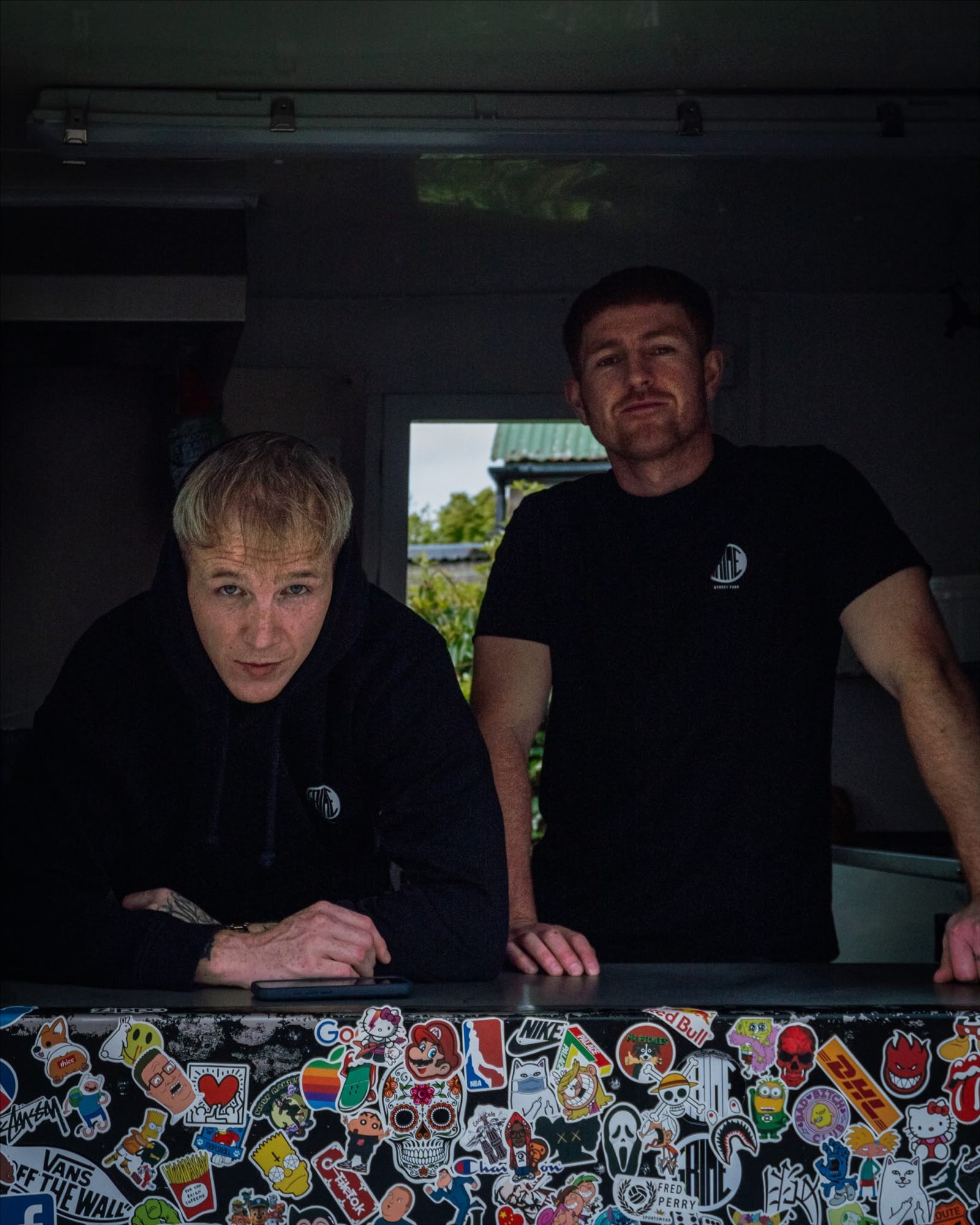 Grime Street Food team behind the sticker-covered counter in Carndonagh